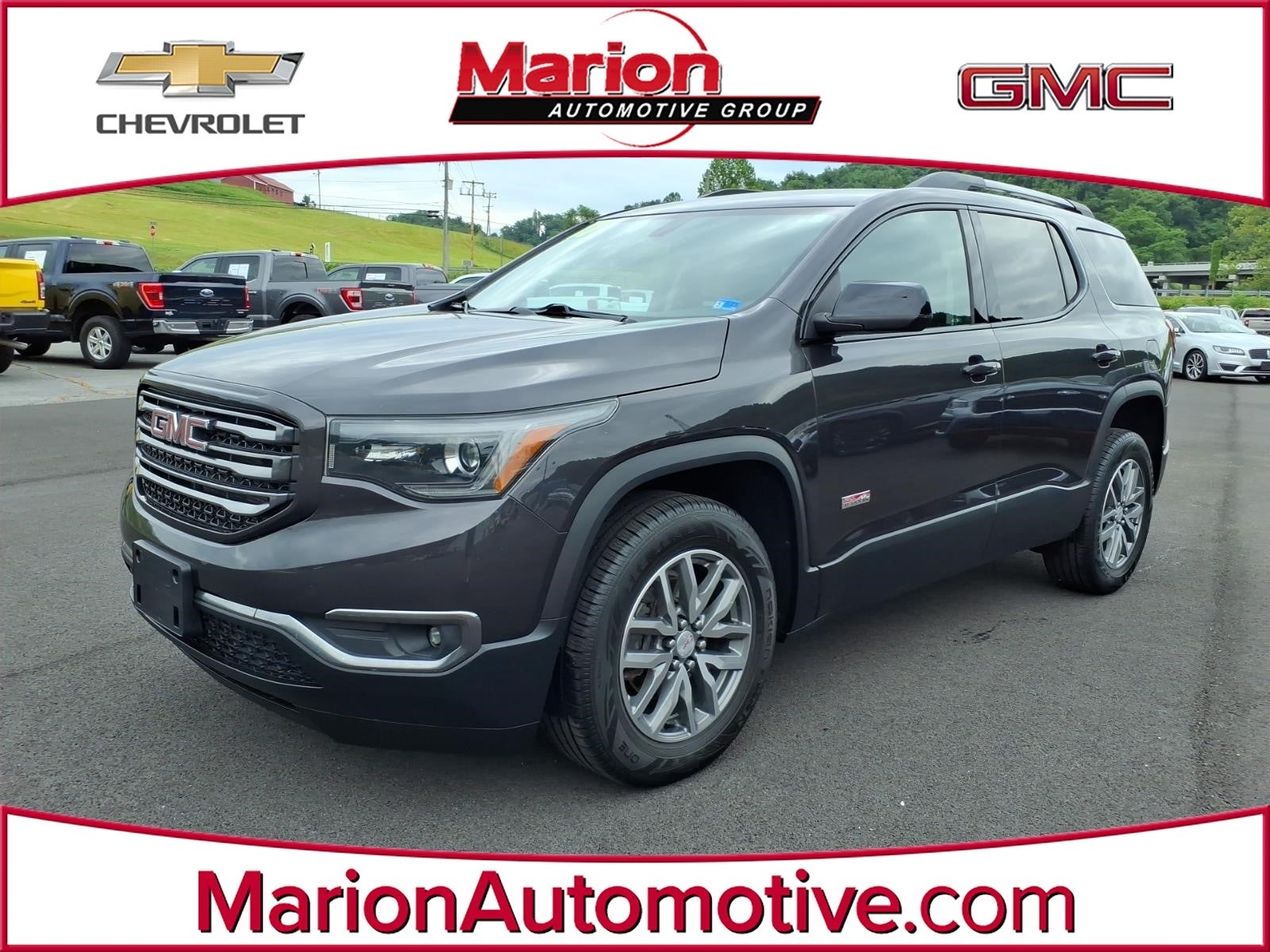 2017 GMC Acadia SLE in Iridium Metallic — front three-quarter view